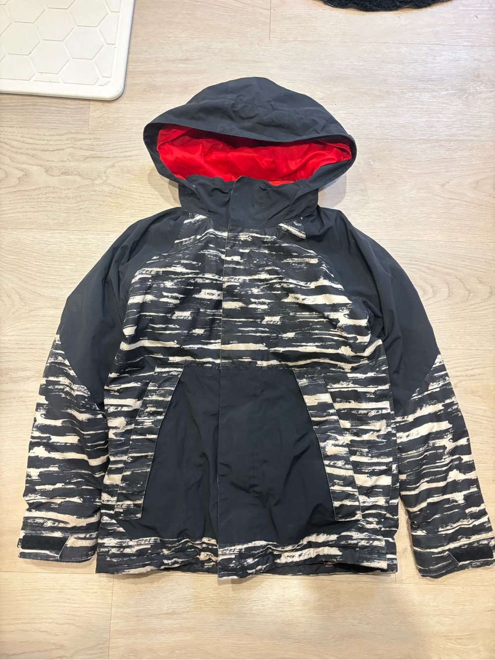 Burton Black Jacket with Red Hood Lining and White Brushstripe Pattern